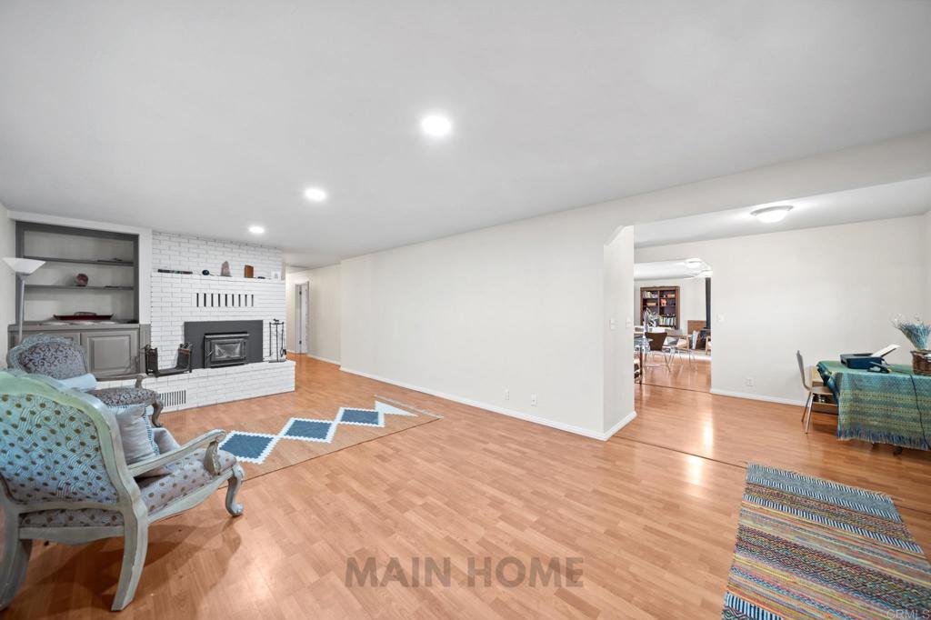 29276 Bullskin Ridge Road Oak Run, CA 96069 - Photo 13 of 21 a workspace with furniture wooden floor and a kitchen