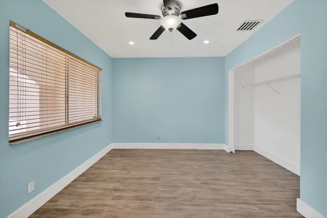 a bathroom with a sink a mirror and a vanity