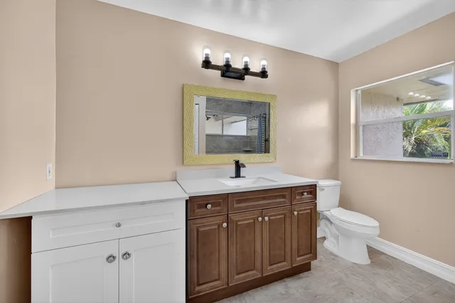 a bathroom with a toilet and a sink