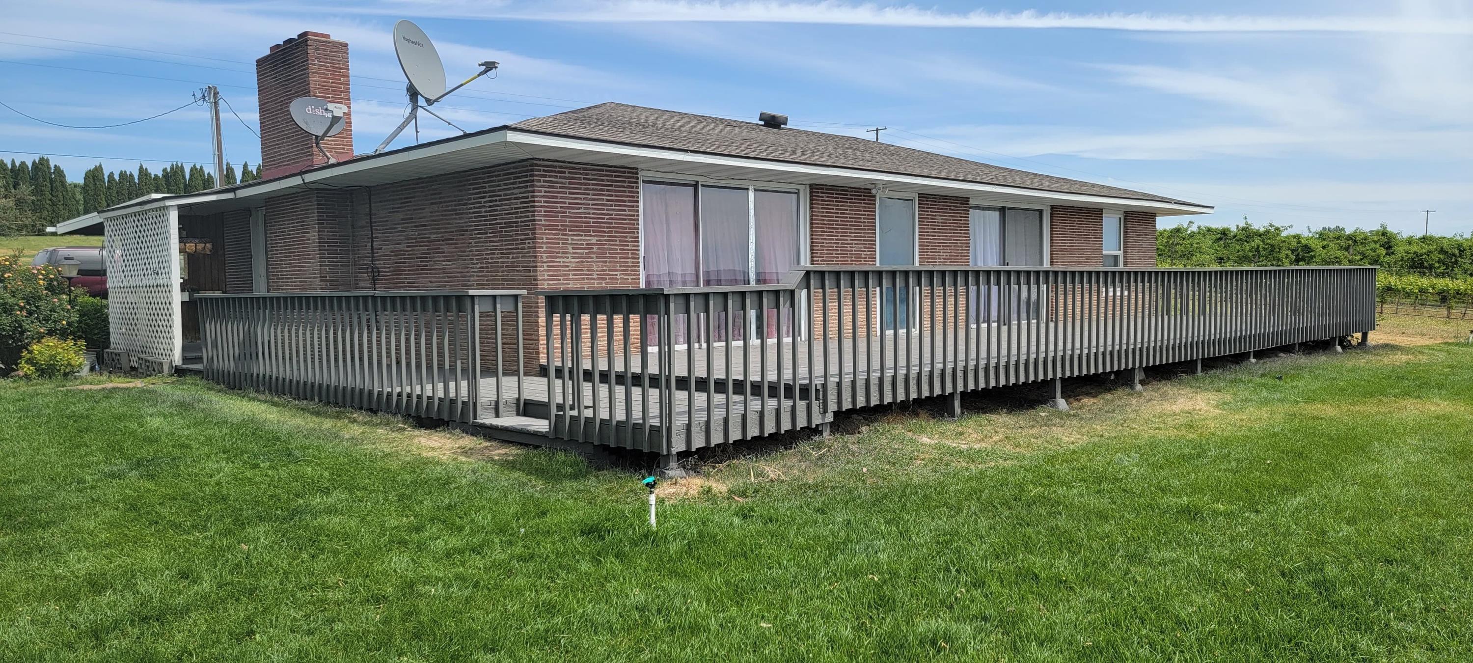 1001 Mohar Road Grandview, WA 98930 - Photo 1 of 1 a view of a backyard with a small cabin