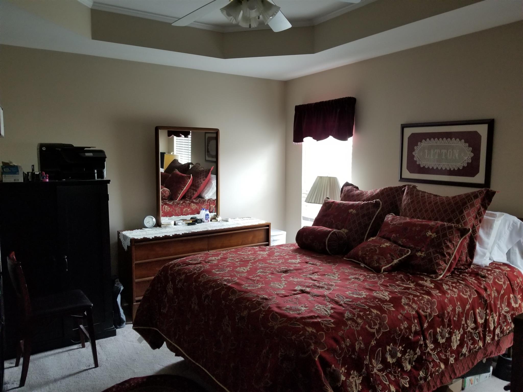 831 Blakemore Road Dickson, TN 37055 - Photo 3 of 17 a bedroom with a bed and a mirror