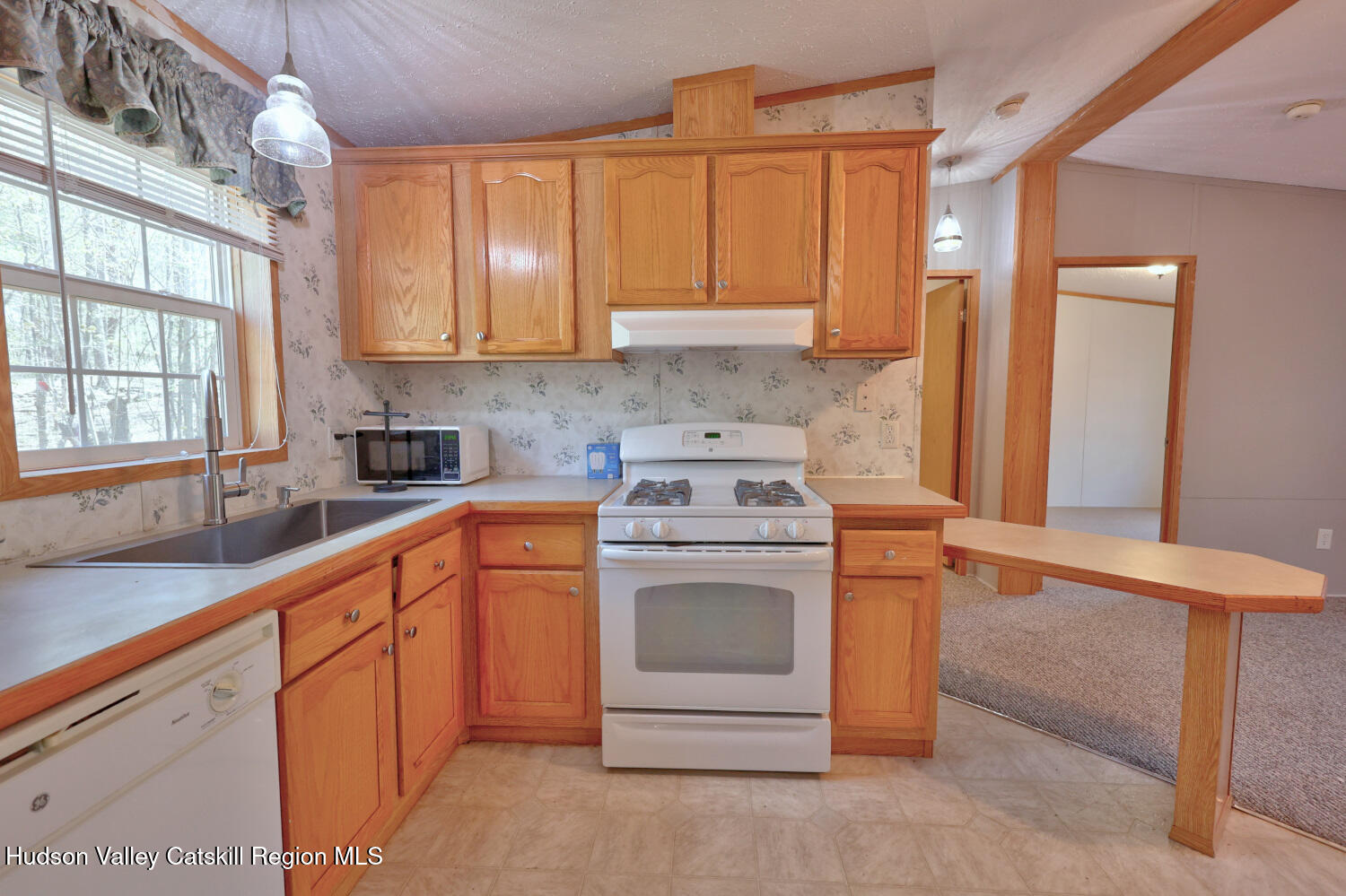 201 Edison Timmerman Road Cairo, NY 12413 - Photo 18 of 49 a kitchen with granite countertop a sink stove and cabinets