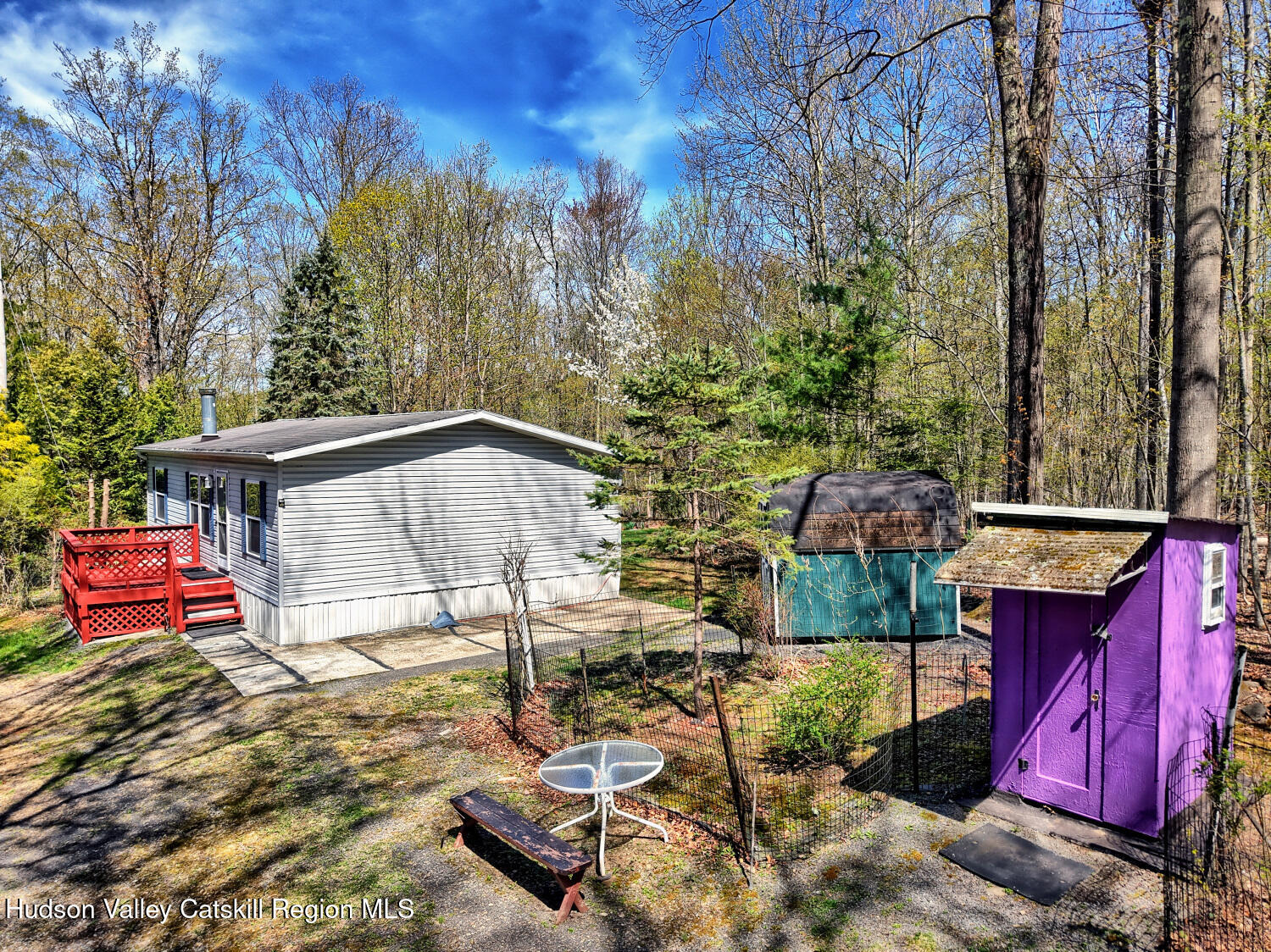 201 Edison Timmerman Road Cairo, NY 12413 - Photo 4 of 49 a backyard of a house with yard and outdoor seating