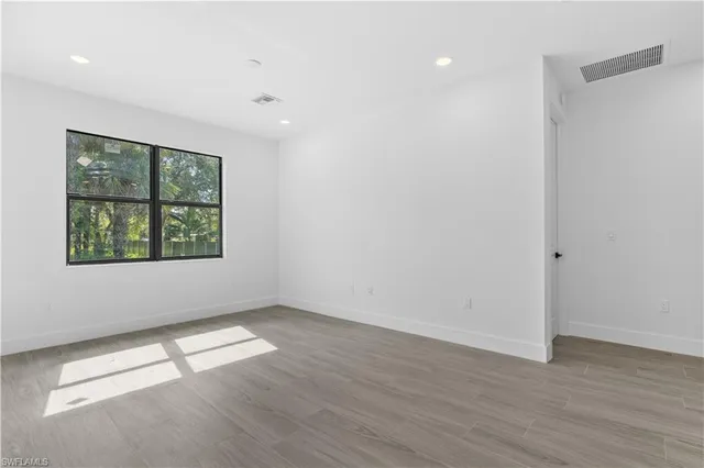 a view of a kitchen with a sink and a large window