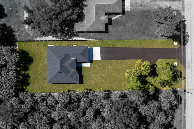 a view of a swimming pool with a yard