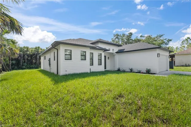 a view of a house with a garden