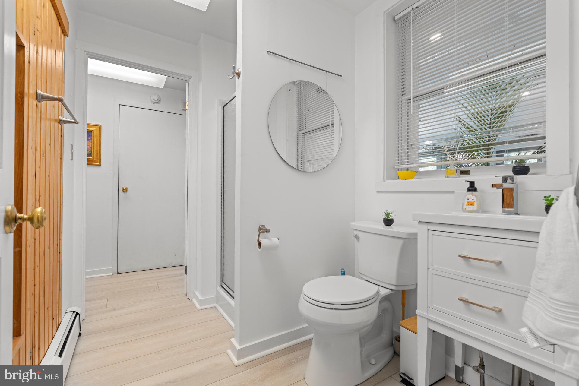 6 Bridge One Lane Pipersville, PA 18947 - Photo 17 of 82 a bathroom with a toilet sink vanity and mirror