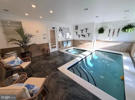 a hallway view with wooden floor