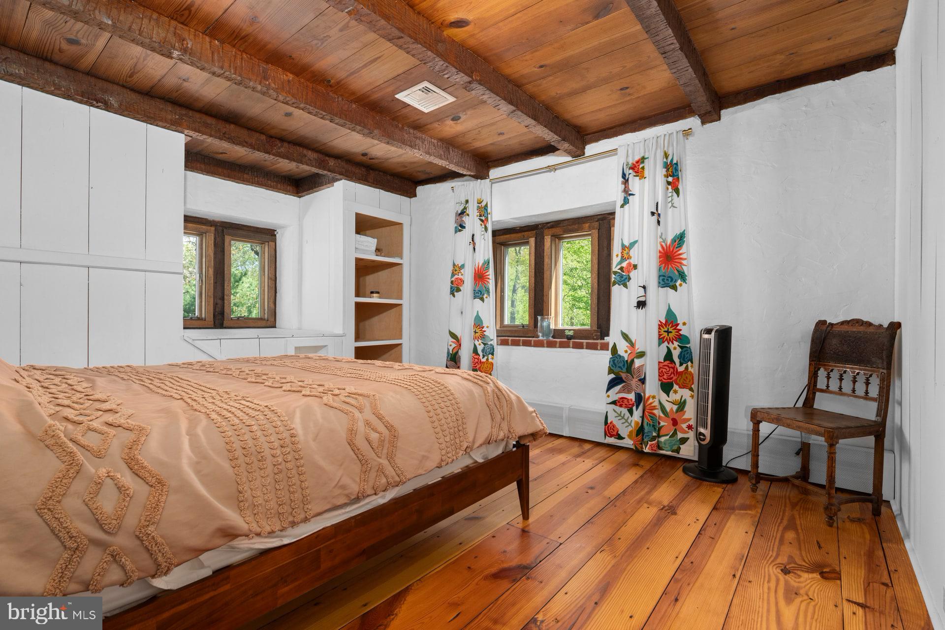 6 Bridge One Lane Pipersville, PA 18947 - Photo 52 of 82 a bedroom with bed and wooden floor