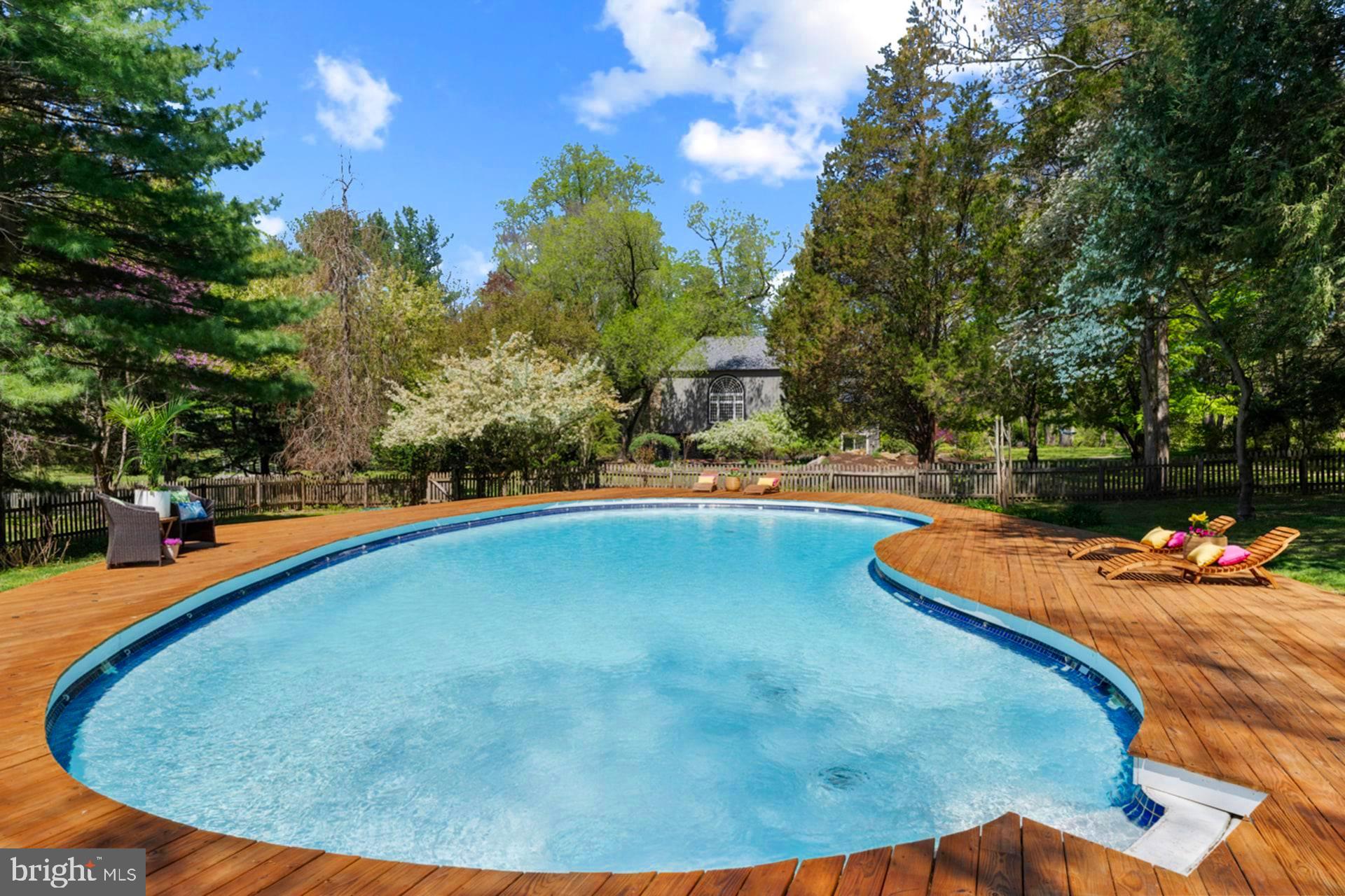 6 Bridge One Lane Pipersville, PA 18947 - Photo 75 of 82 a view of a swimming pool with an outdoor space and seating area