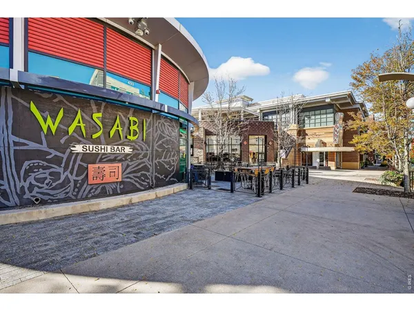 a view of a cafe with sitting area