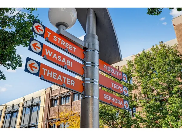 a street sign on a pole on a street