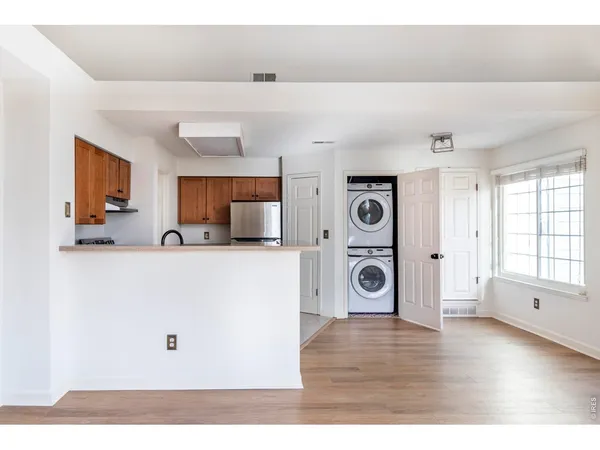 a view of a livingroom with wooden floor