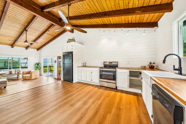 a view of a kitchen with a sink and a window