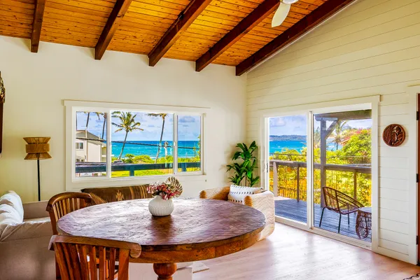 a balcony with wooden floor and fence