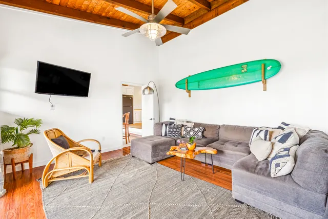a bathroom with a granite countertop sink a toilet and a mirror