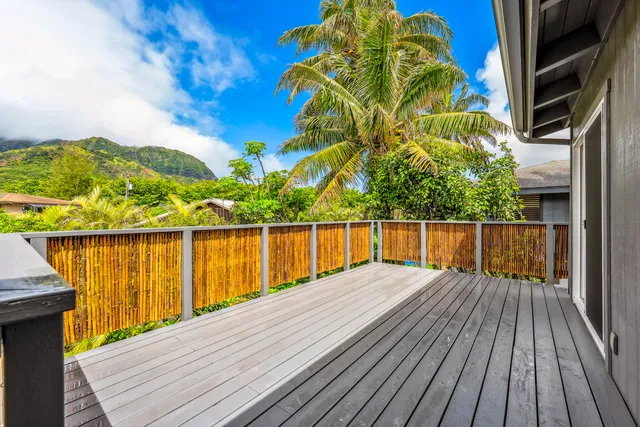 a balcony with table and chairs
