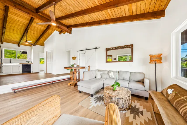 a view of a patio with couches and pool