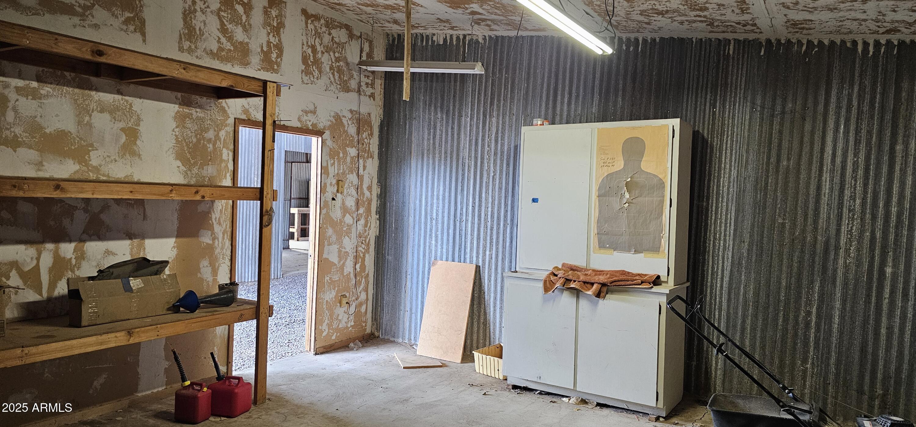 129 South 1st Street Buckeye, AZ 85326 - Photo 11 of 16 a view of walk in closet with clothes and shoes