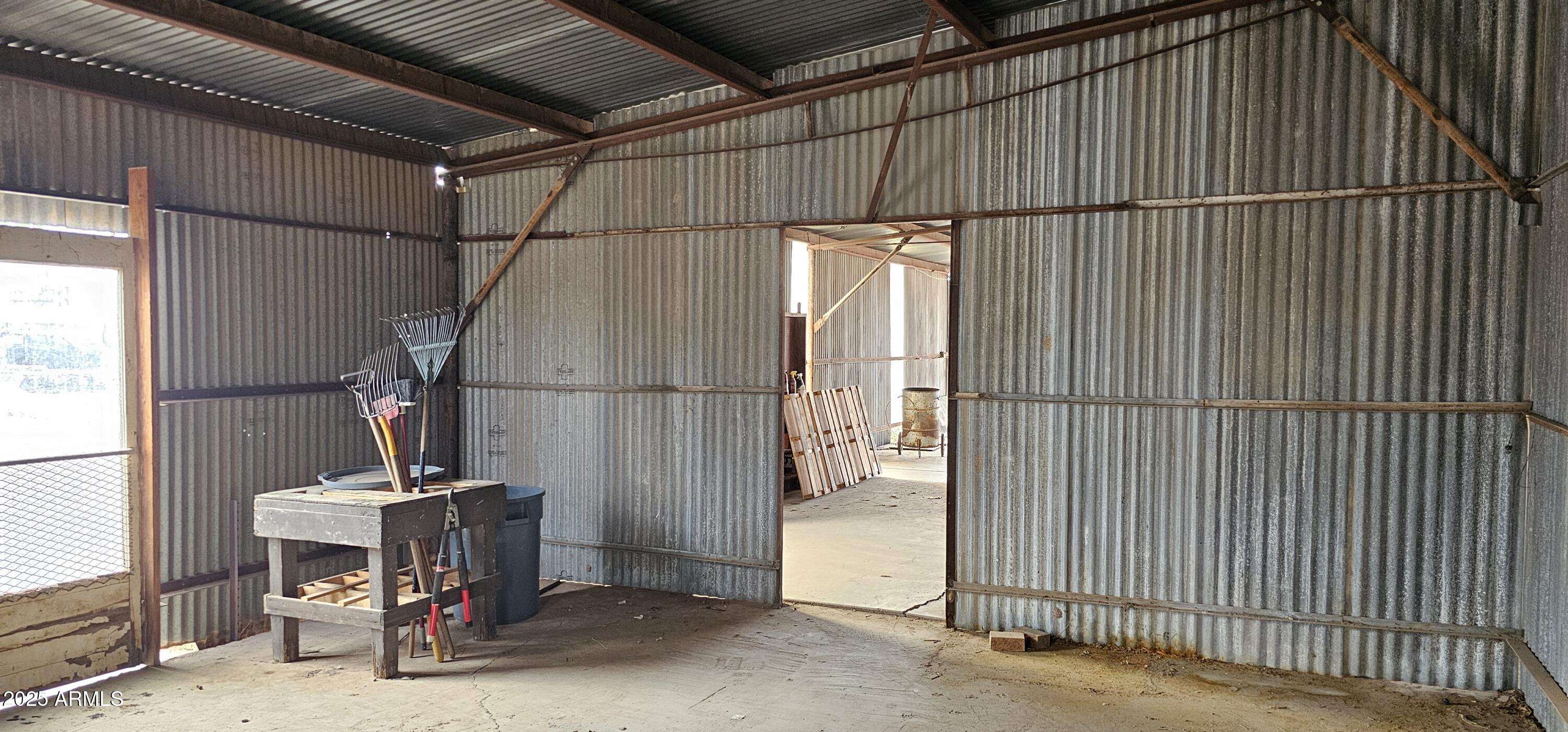 129 South 1st Street Buckeye, AZ 85326 - Photo 12 of 16 a view of a room with wooden floor and windows