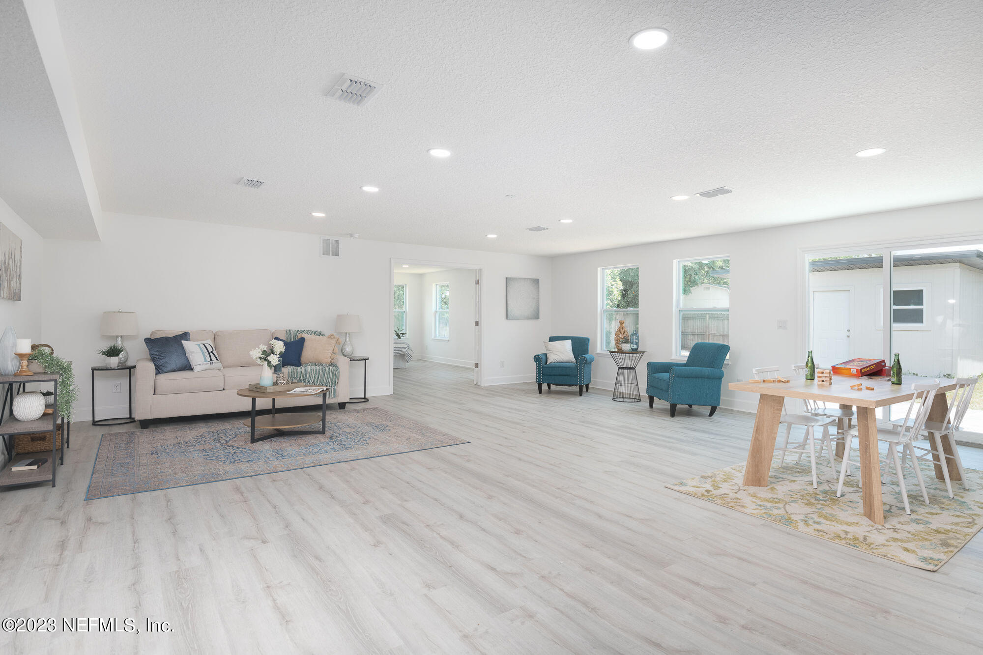 425 Penman Road Neptune Beach, FL 32266 - Photo 1 of 19 a living room with furniture and a table