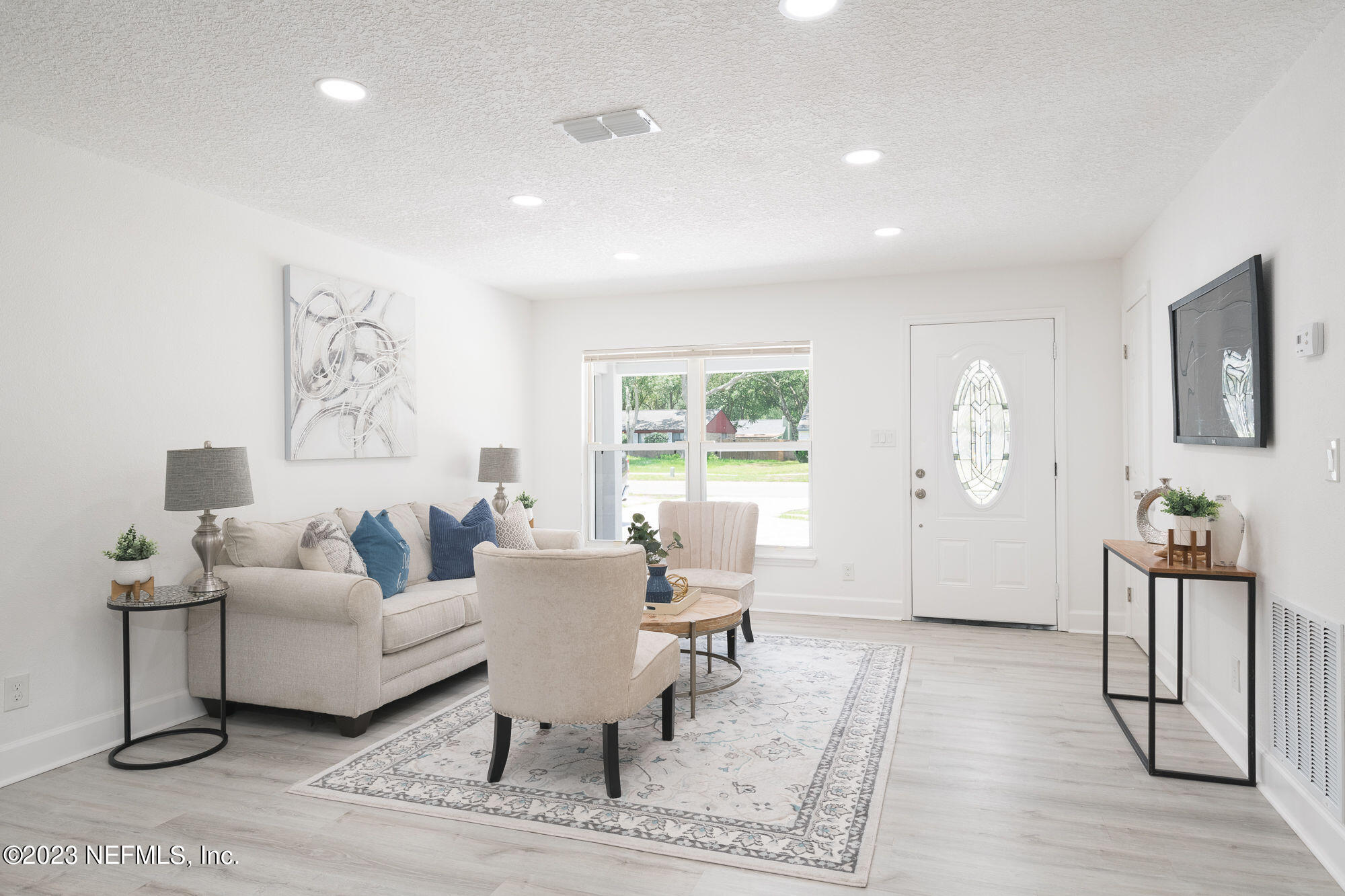 425 Penman Road Neptune Beach, FL 32266 - Photo 4 of 19 a living room with furniture and wooden floor