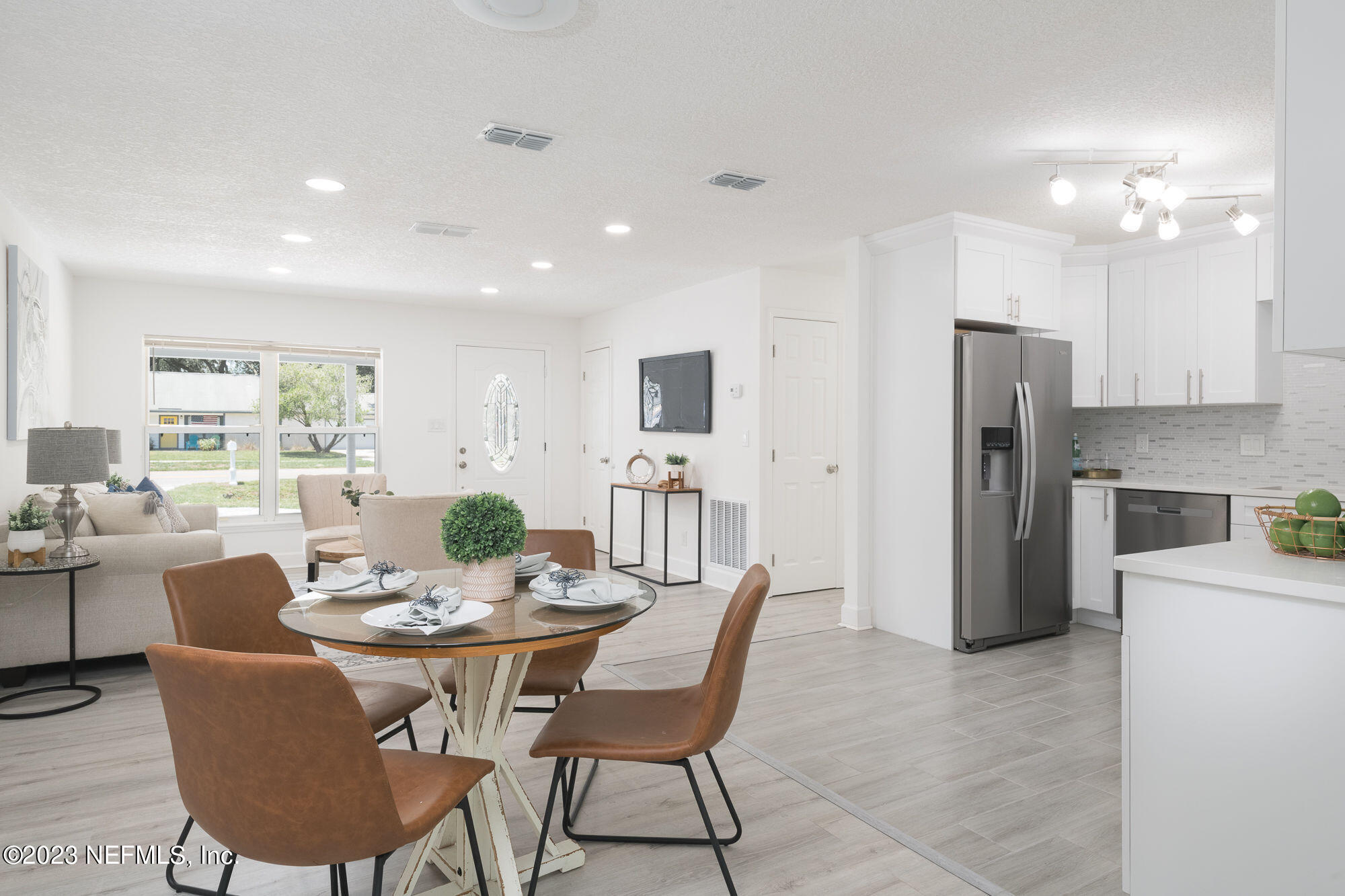 425 Penman Road Neptune Beach, FL 32266 - Photo 6 of 19 a dining room with furniture a window and kitchen view