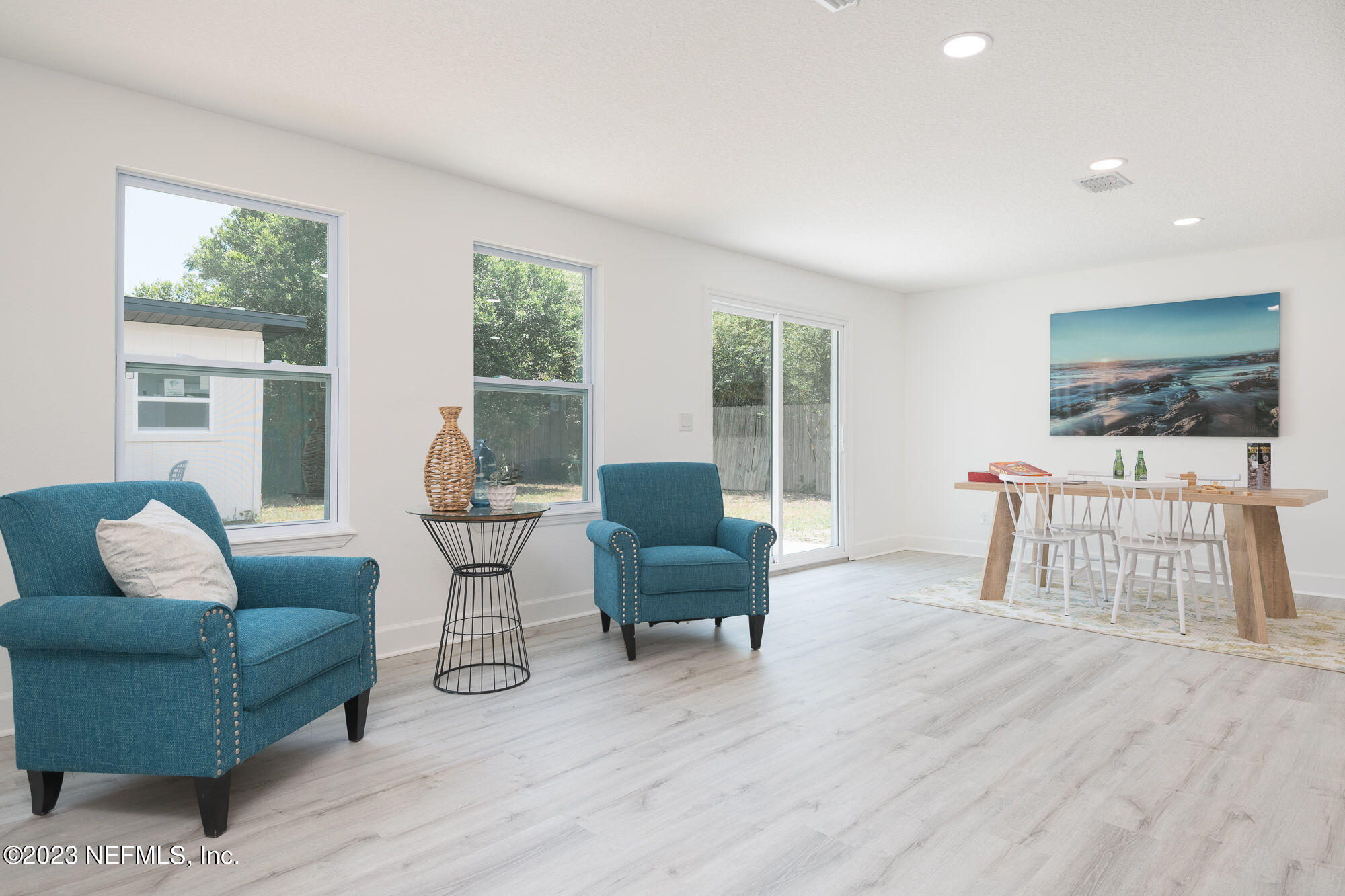 425 Penman Road Neptune Beach, FL 32266 - Photo 7 of 19 a living room with furniture and a flat screen tv