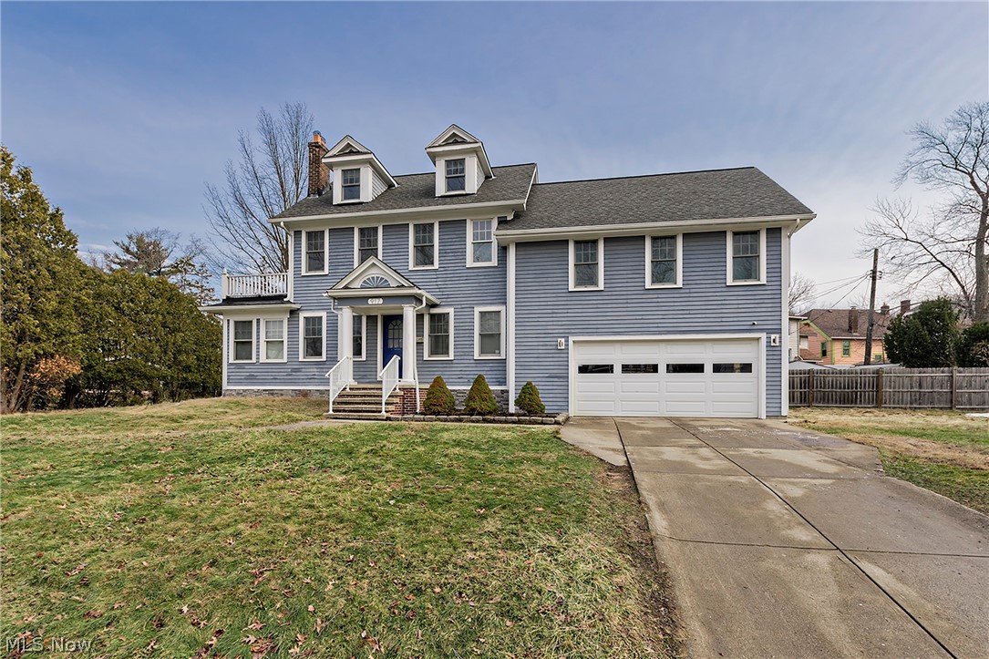 Classic Cleveland Heights colonial with two car attached garage.