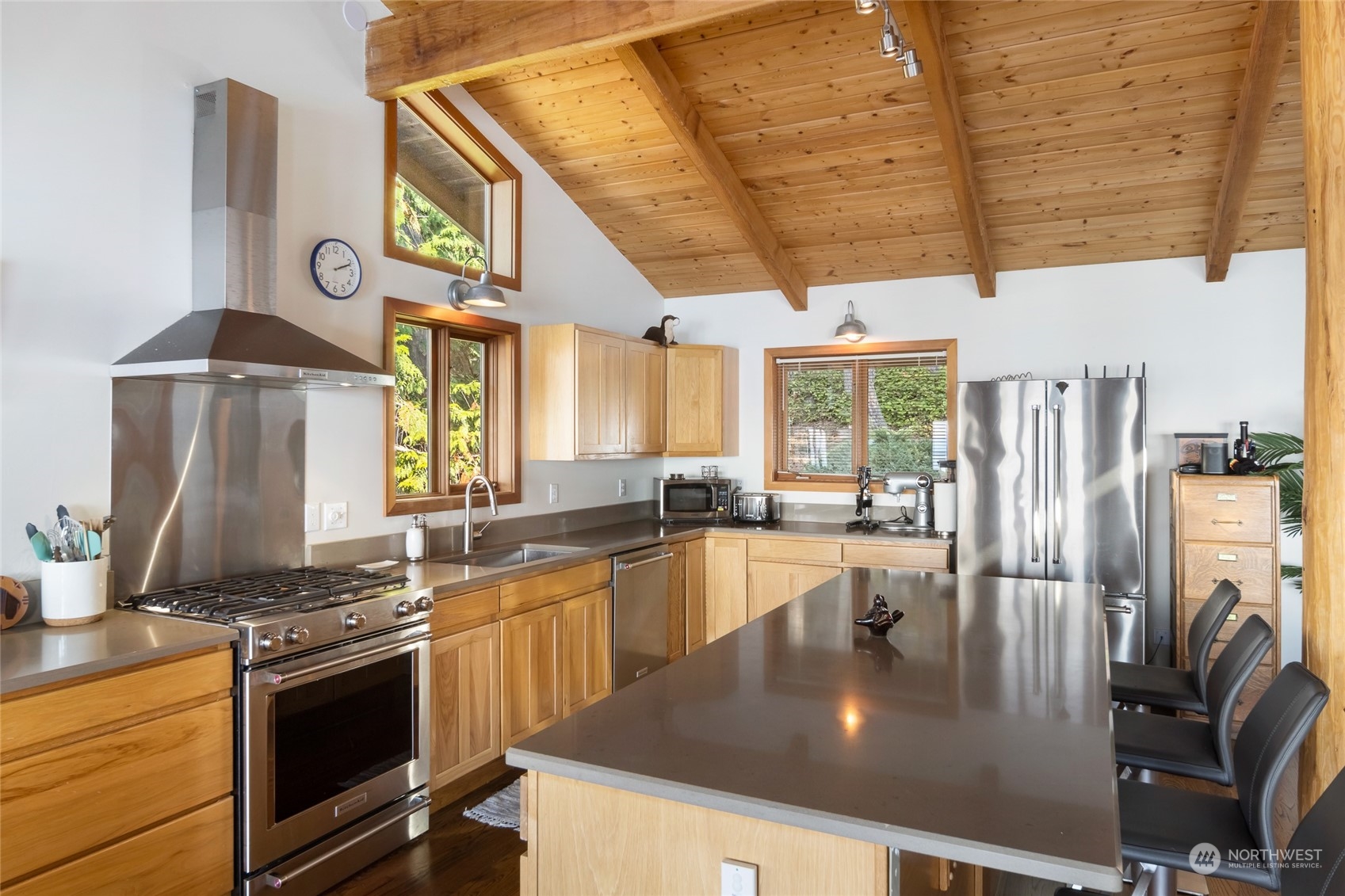 449 Madrona Drive San Juan Island, WA 98250 - Photo 15 of 27 a kitchen with stainless steel appliances granite countertop a sink a stove and a refrigerator