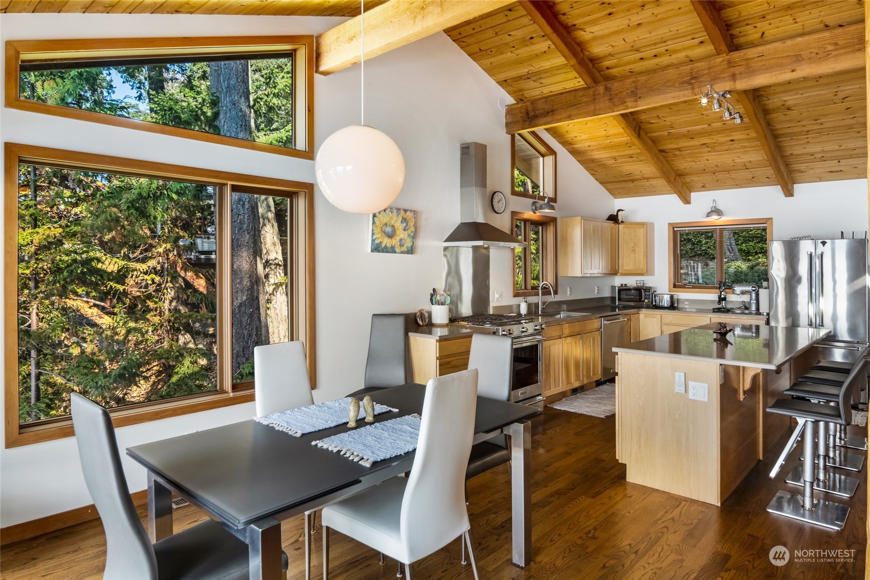 449 Madrona Drive San Juan Island, WA 98250 - Photo 16 of 27 a dining room with furniture and wooden floor