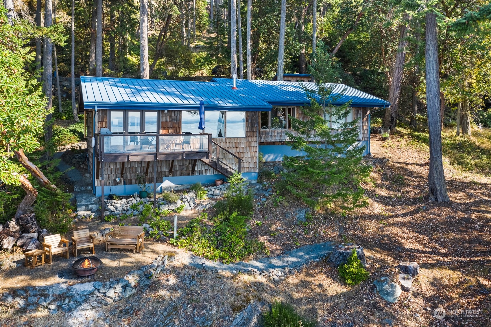 449 Madrona Drive San Juan Island, WA 98250 - Photo 20 of 27 a view of a table and chairs under an umbrella