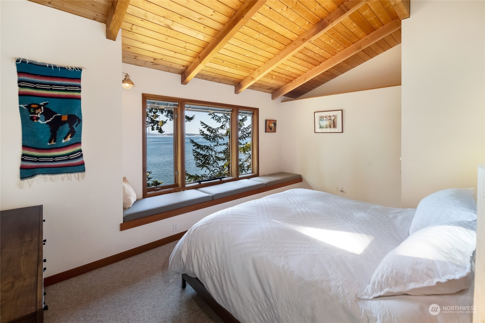 449 Madrona Drive San Juan Island, WA 98250 - Photo 22 of 27 a bedroom with a bed and a large window