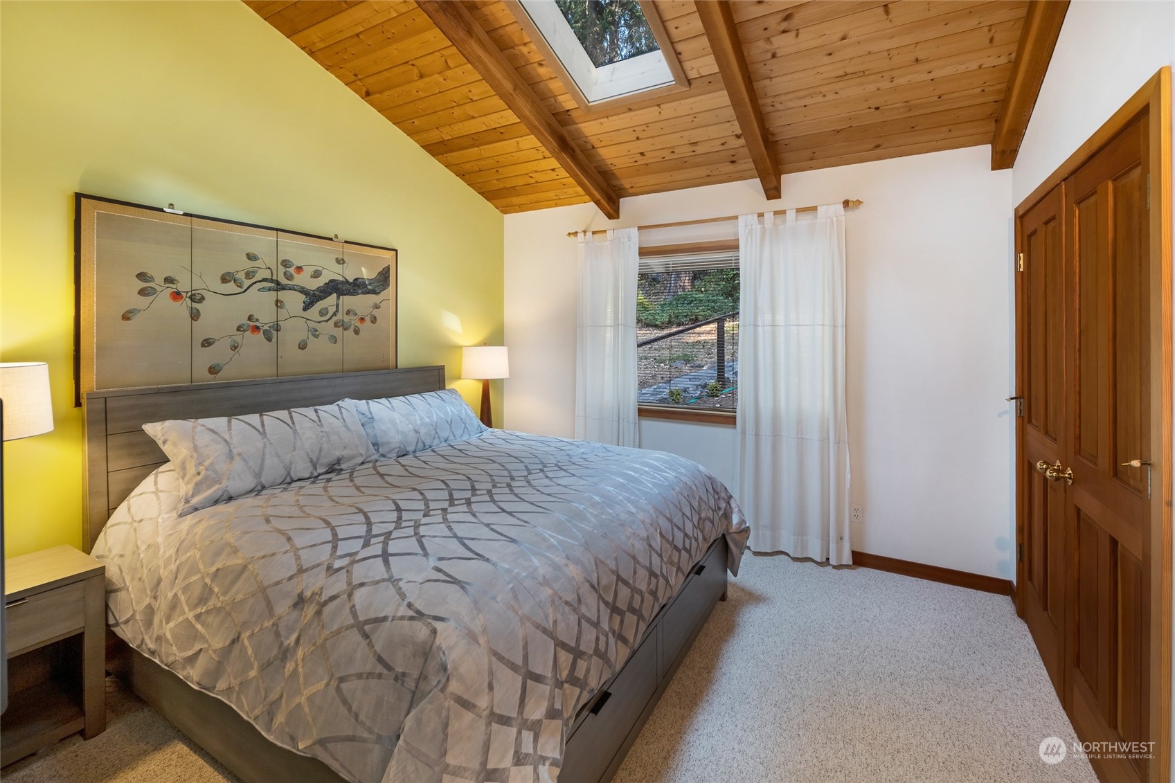 449 Madrona Drive San Juan Island, WA 98250 - Photo 24 of 27 a large bed sitting in a bedroom next to a window