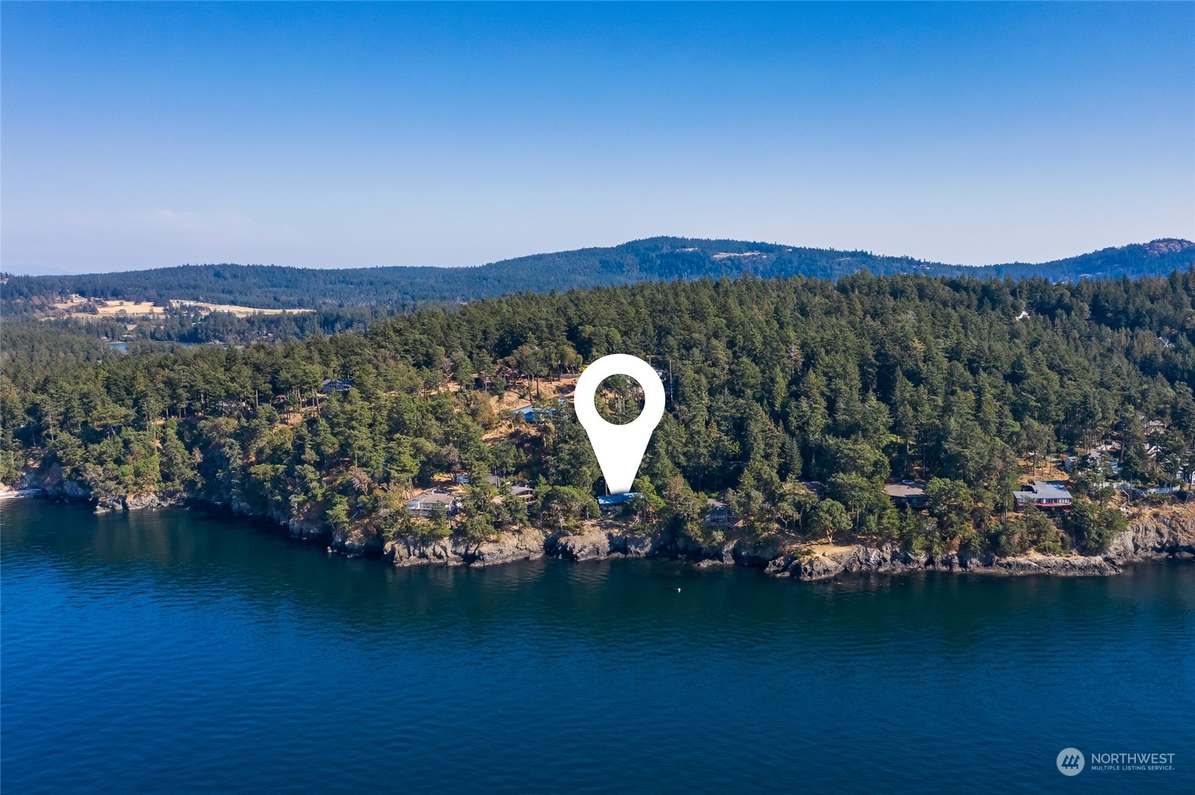 449 Madrona Drive San Juan Island, WA 98250 - Photo 25 of 27 a view of a lake with a mountain in the background