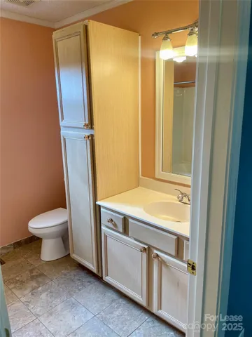a view of a livingroom with a ceiling fan and window