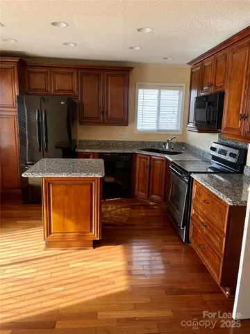 a view of a backyard with large trees