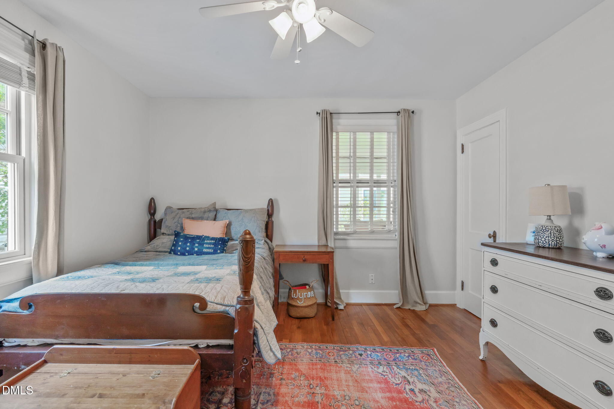 2111 Pershing Street Durham, NC 27705 - Photo 30 of 59 a room with a bed and wooden floor