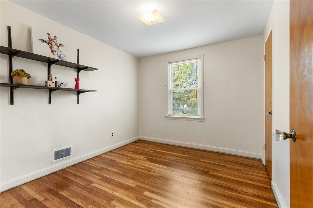5 Gerry Road Lynnfield, MA 01940 - Photo 14 of 22 a view of a room with wooden floor and windows