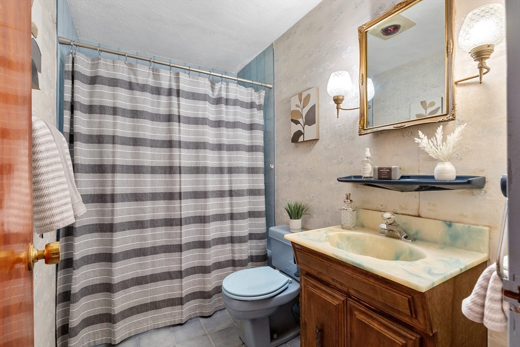 5 Gerry Road Lynnfield, MA 01940 - Photo 16 of 22 a bathroom with a sink toilet and shower