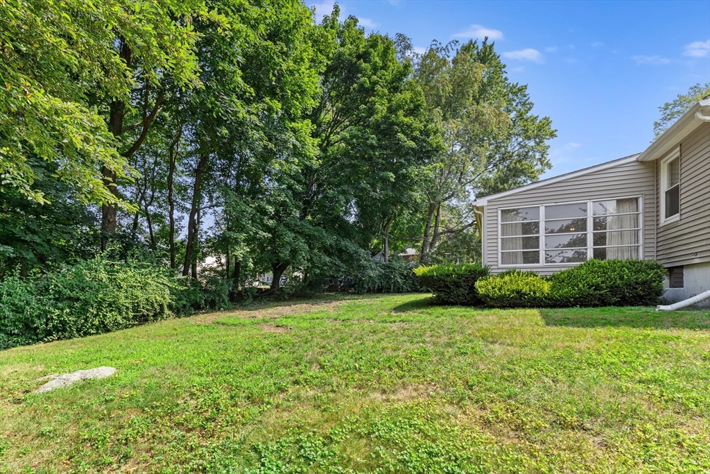 5 Gerry Road Lynnfield, MA 01940 - Photo 17 of 22 a view of a house with a backyard
