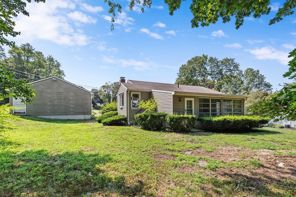 5 Gerry Road Lynnfield, MA 01940 - Photo 19 of 22 a view of a house with a big yard and potted plants and large tree