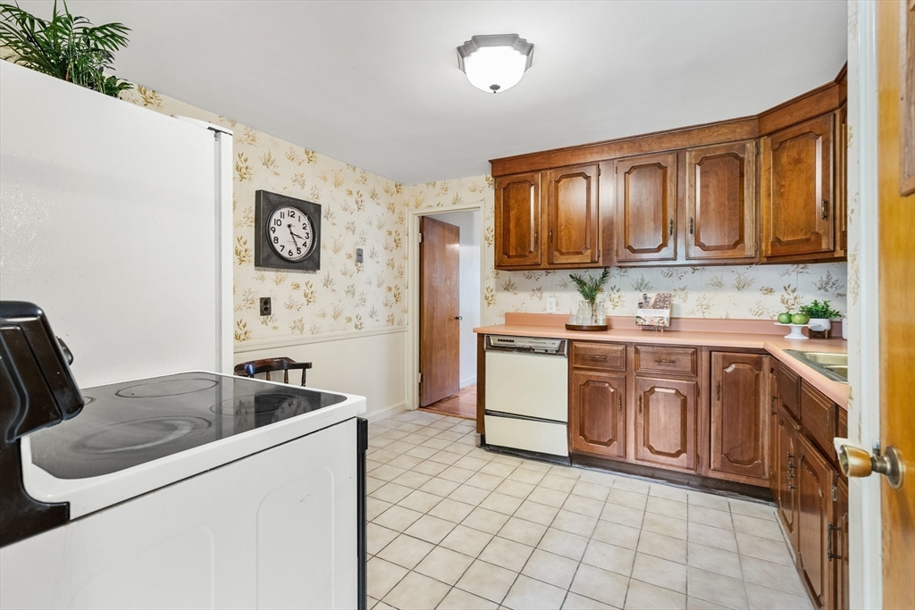 5 Gerry Road Lynnfield, MA 01940 - Photo 8 of 22 a kitchen with a cabinets and appliances