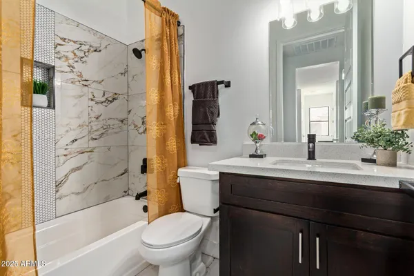 a bathroom with a sink a toilet and a bathtub