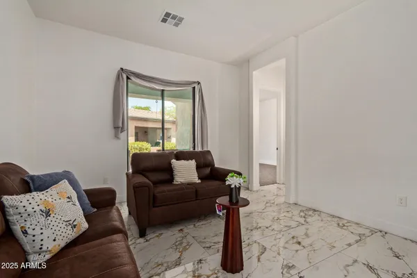 a living room with furniture and a window