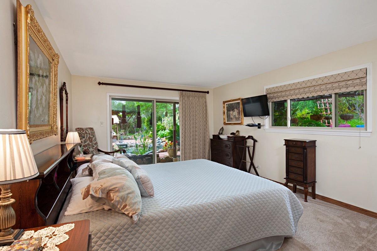 3442 Bumann Road Encinitas, CA 92024 - Photo 9 of 25 MASTER BEDROOM HAS SLIDING GLASS DOOR LEADING TO KOI POND/SIDE YARD