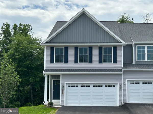 a view of house with yard
