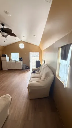 a spacious bedroom with a bed and window