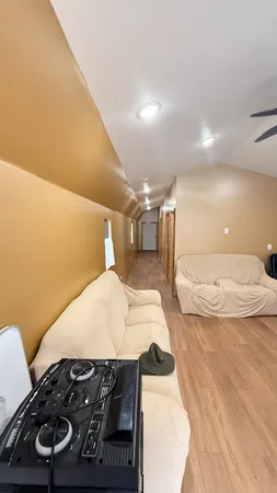 a bedroom with a bed and a mirror