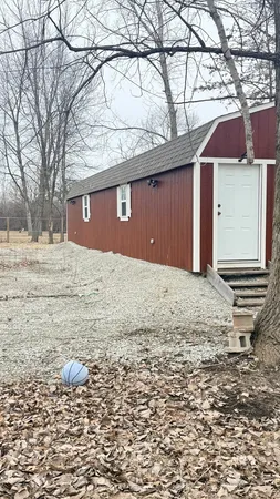 a view of a backyard of the house